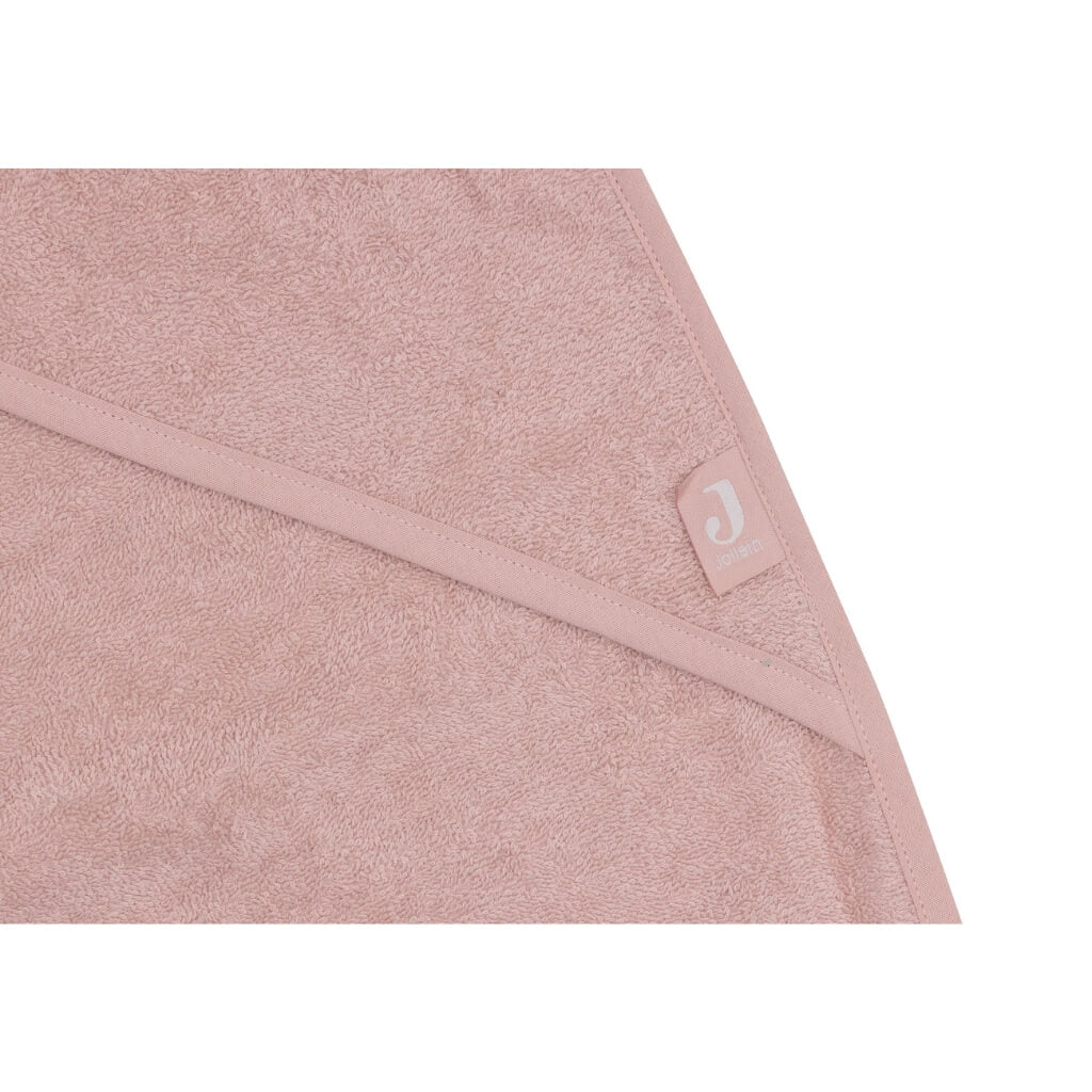Nahaufnahme des Frottee Stoffes des Baby Kaputzen-Handtuchs in rosa
